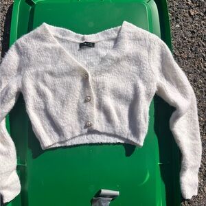 white fluffy sweater with pearl buttons